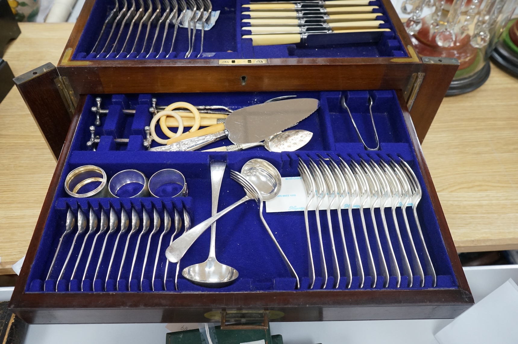 A Walker & Hall three-drawer canteen of plated cutlery. Canteen 48cm wide x 35cm deep x 24cm high. Condition - good